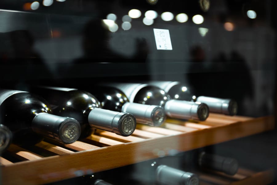 Storing Bottles Of Wine In Fridge In A Restaurant Setting.